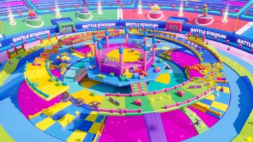 Top-down view of 3D battle stadium arena showing detailed circular layout with colorful platforms, character pedestals, and sparkler effects