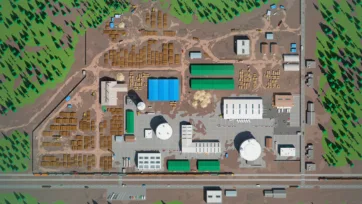 Large-scale sawmill complex overview with extensive lumber storage yards, processing buildings, and industrial infrastructure from aerial perspective