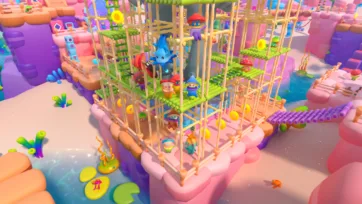 Adventure Land 3D low poly multi-level scaffolding structure with various characters including dragon and creatures in vibrant setting