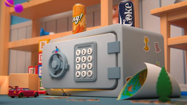 A toy safe with a keypad, two soda cans, and tiny figures in a playroom.